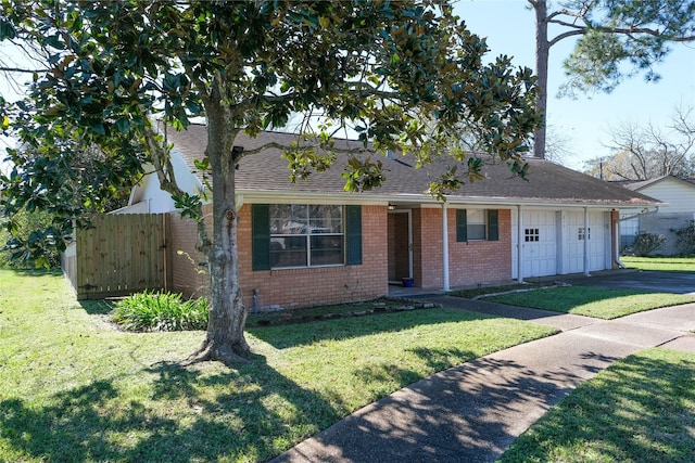 ranch-style house with a garage and a front yard