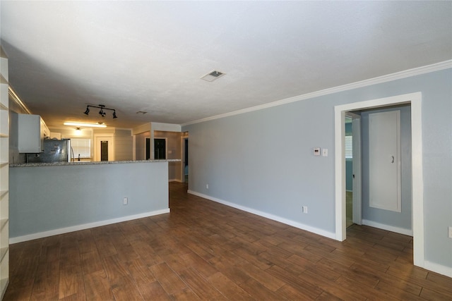 unfurnished living room with crown molding, rail lighting, and dark hardwood / wood-style floors