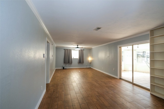 spare room with hardwood / wood-style flooring and ornamental molding