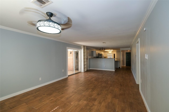 unfurnished living room featuring dark wood-type flooring and ornamental molding