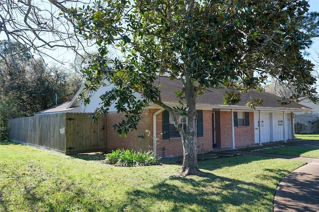 view of front facade with a garage and a front lawn