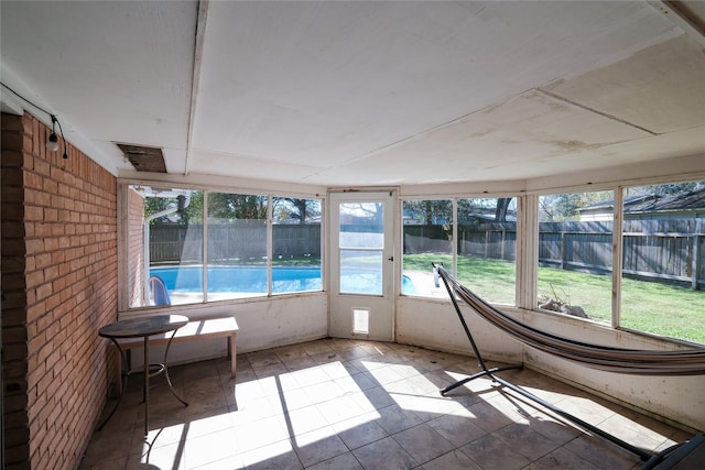 unfurnished sunroom with a wealth of natural light