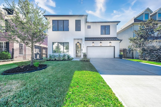 view of front of house with a garage and a front lawn