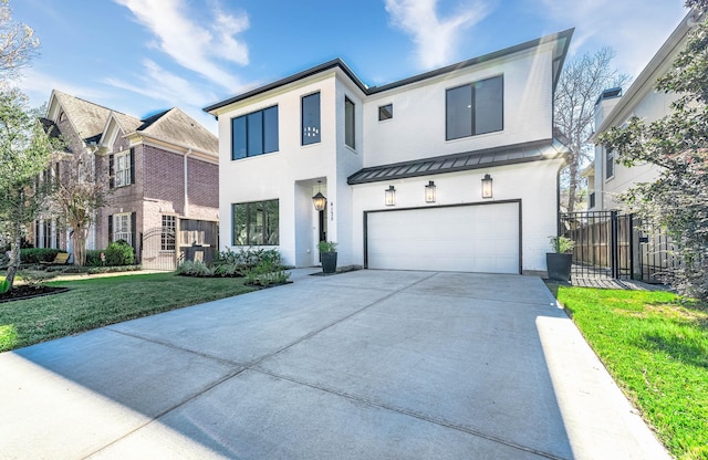 view of front of home with a front yard and a garage