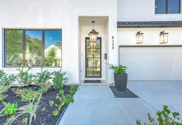 doorway to property with a garage