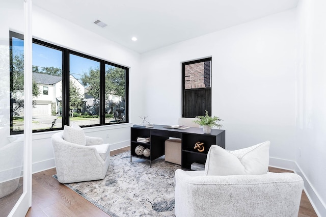 office space with wood-type flooring