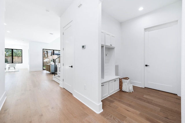 hall with light wood-type flooring