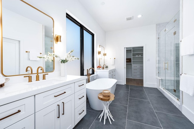 bathroom featuring separate shower and tub, tile patterned floors, and vanity