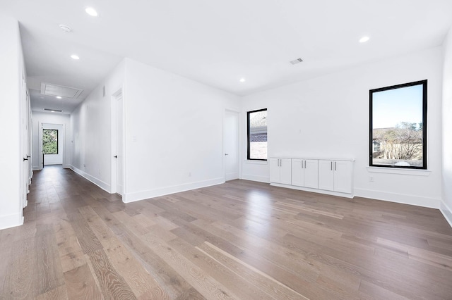 spare room with light hardwood / wood-style flooring