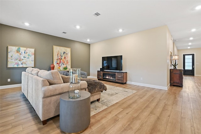 living room with light hardwood / wood-style floors