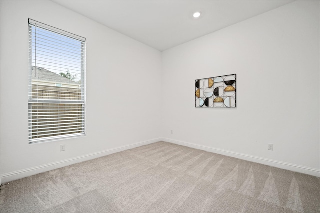 unfurnished room with carpet flooring