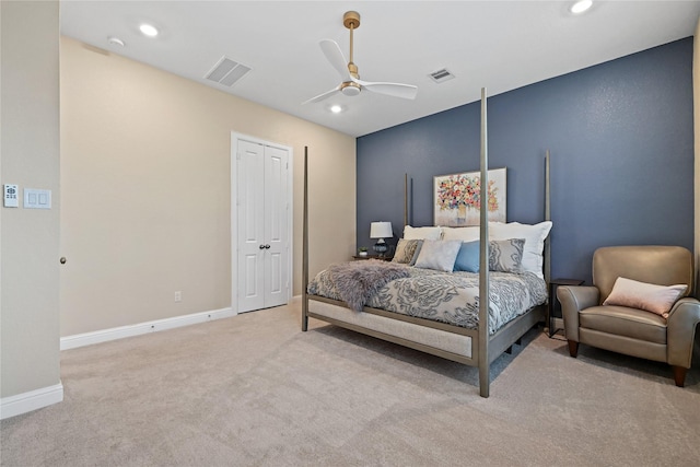 carpeted bedroom with a closet and ceiling fan