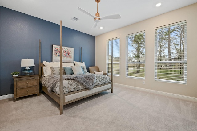 bedroom featuring ceiling fan and light colored carpet