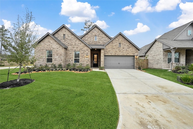 view of front of home featuring a front yard and a garage