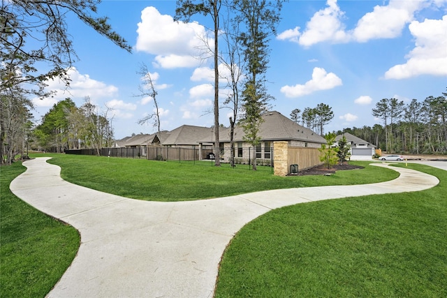 view of home's community featuring a yard