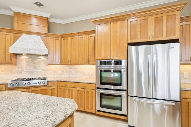 kitchen with premium range hood, crown molding, stainless steel appliances, light stone countertops, and decorative backsplash