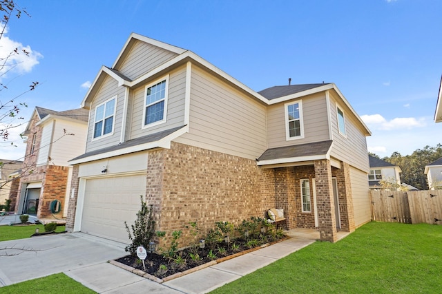 view of front of property with a garage and a front yard