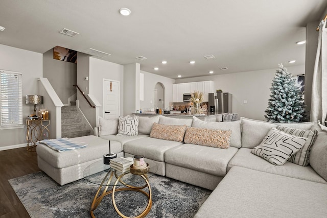 living room featuring dark wood-type flooring