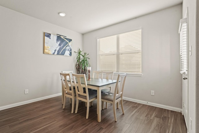 dining room with dark hardwood / wood-style floors