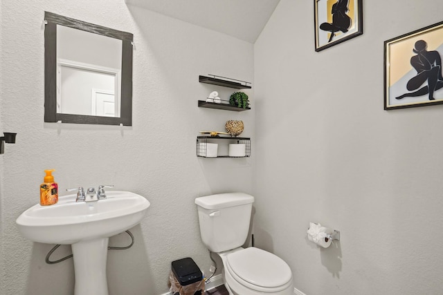 bathroom featuring toilet