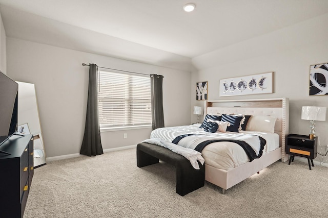 bedroom featuring carpet floors and lofted ceiling