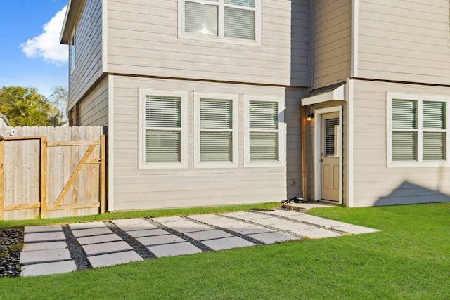 exterior space with a patio and a lawn