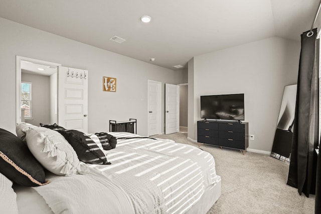 carpeted bedroom featuring lofted ceiling