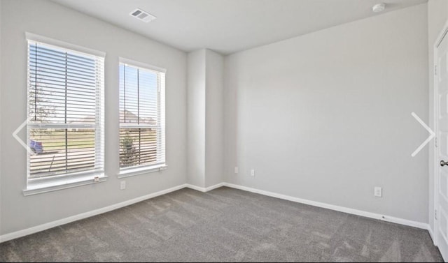 unfurnished room featuring carpet flooring