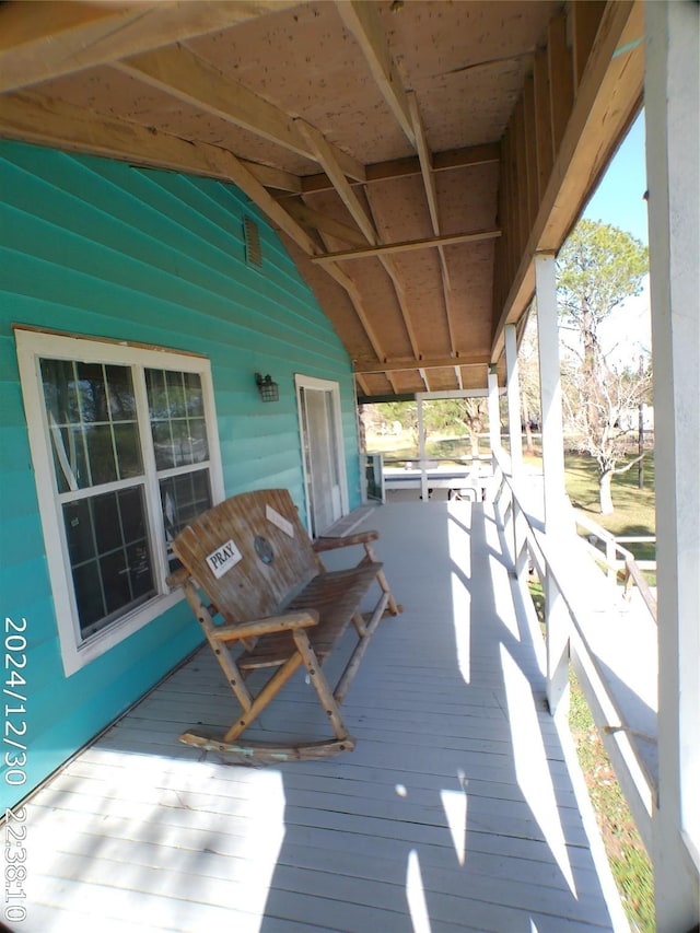 wooden deck featuring covered porch