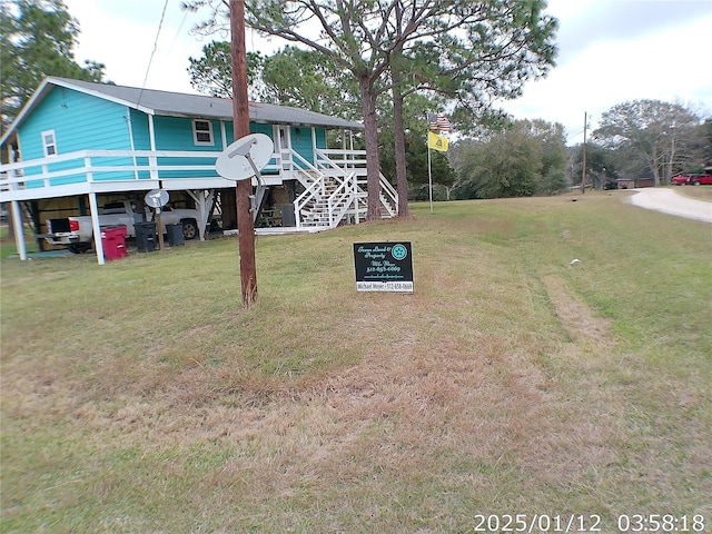 view of yard featuring a wooden deck