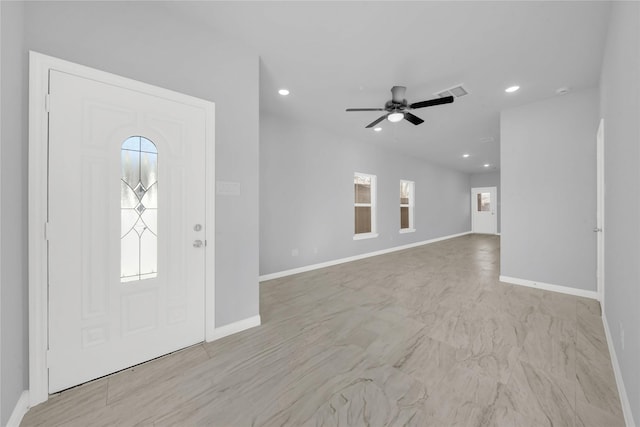 entrance foyer with ceiling fan