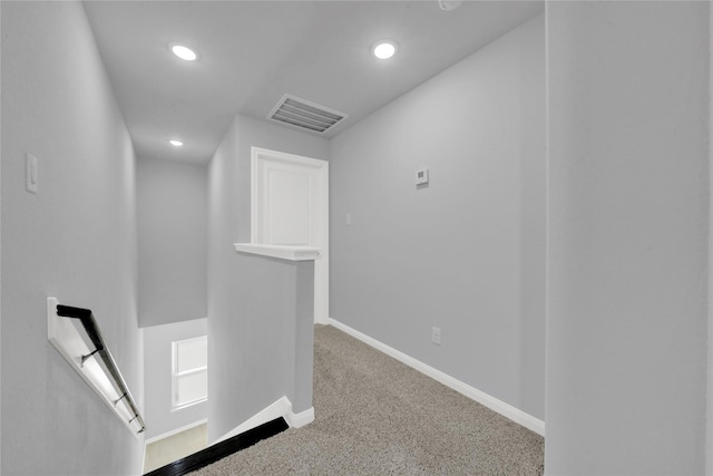 hallway with carpet floors