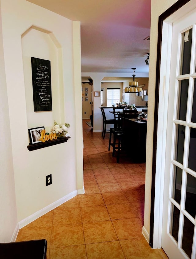 corridor featuring tile patterned flooring