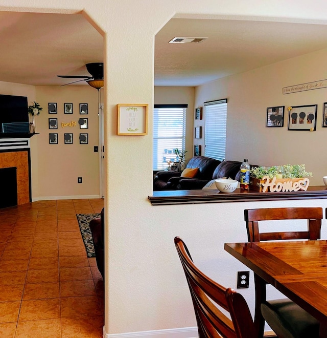 dining room featuring tile patterned floors and ceiling fan