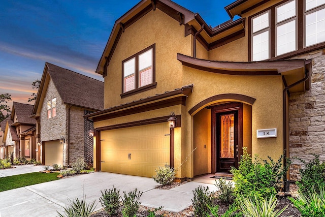 view of front of property with a garage