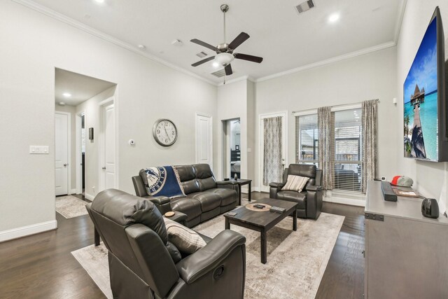 living room featuring a high ceiling, ceiling fan, ornamental molding, and dark hardwood / wood-style floors