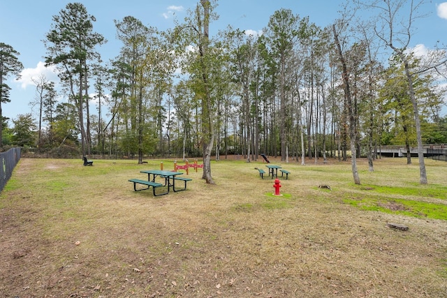 view of home's community with a yard