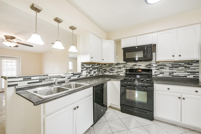 kitchen featuring decorative backsplash, sink, black appliances, decorative light fixtures, and white cabinets