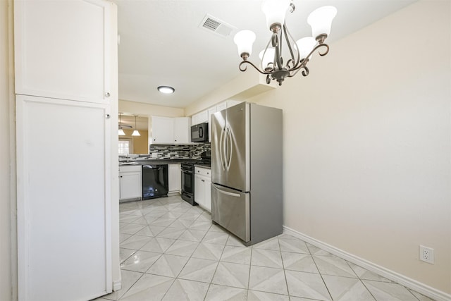 kitchen with hanging light fixtures, an inviting chandelier, tasteful backsplash, white cabinets, and black appliances