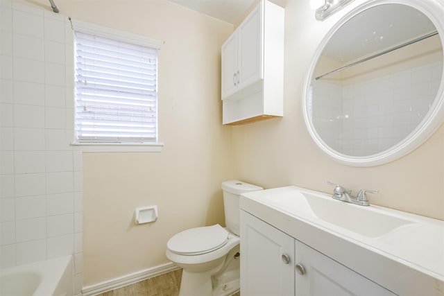 full bathroom featuring hardwood / wood-style floors, vanity, shower / bathtub combination, and toilet