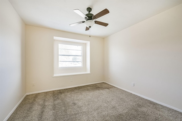 empty room with ceiling fan and carpet floors