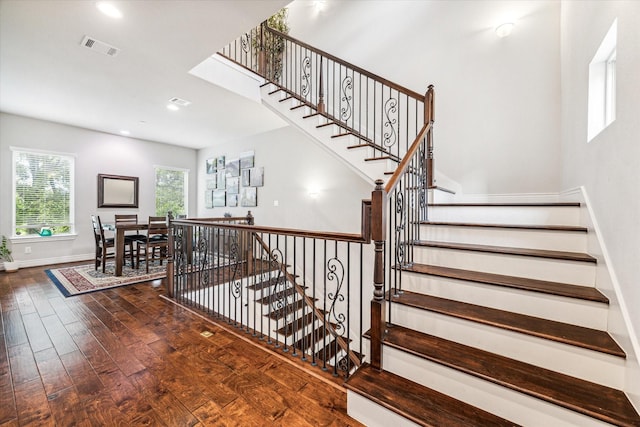 stairs featuring wood-type flooring