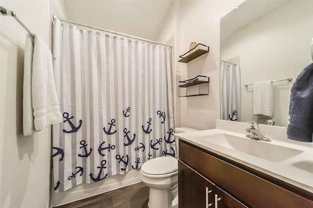 full bathroom featuring wood-type flooring, vanity, toilet, and shower / bath combo with shower curtain