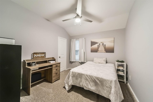 bedroom with dark colored carpet, ceiling fan, and lofted ceiling