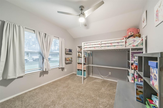 bedroom featuring ceiling fan, lofted ceiling, and light carpet