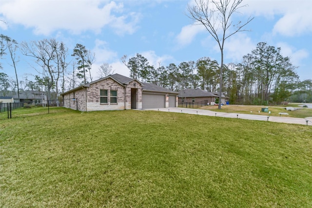 view of front of property featuring a garage and a front lawn