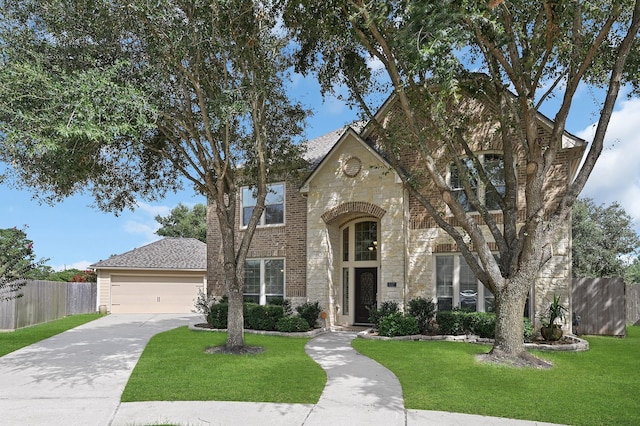 view of front facade with a front yard and a garage