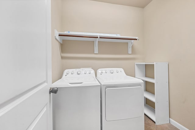 washroom with light tile patterned floors and independent washer and dryer