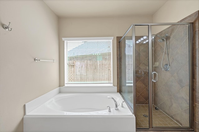 bathroom with shower with separate bathtub