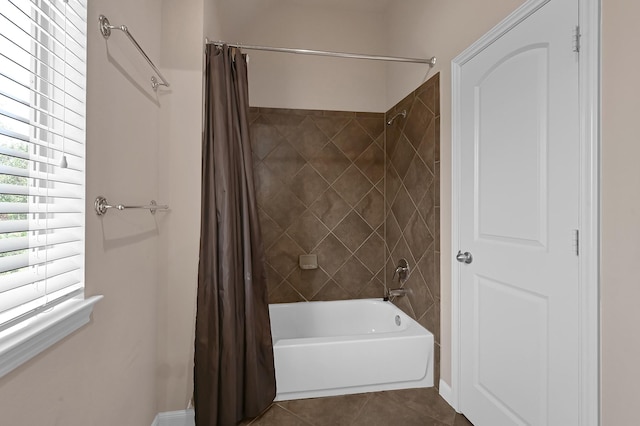 bathroom with tile patterned flooring and shower / bath combo with shower curtain